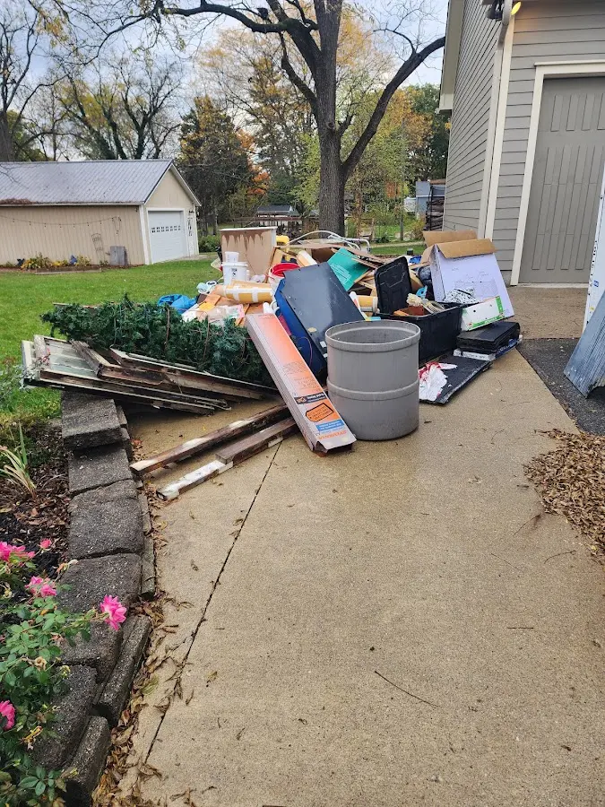 Dumpster being loaded with debris for Demolition Dumpster Rental in Conyers
